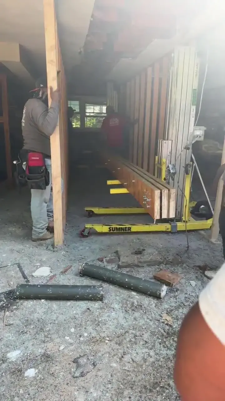 New structural beam raised with a lift, job-site video