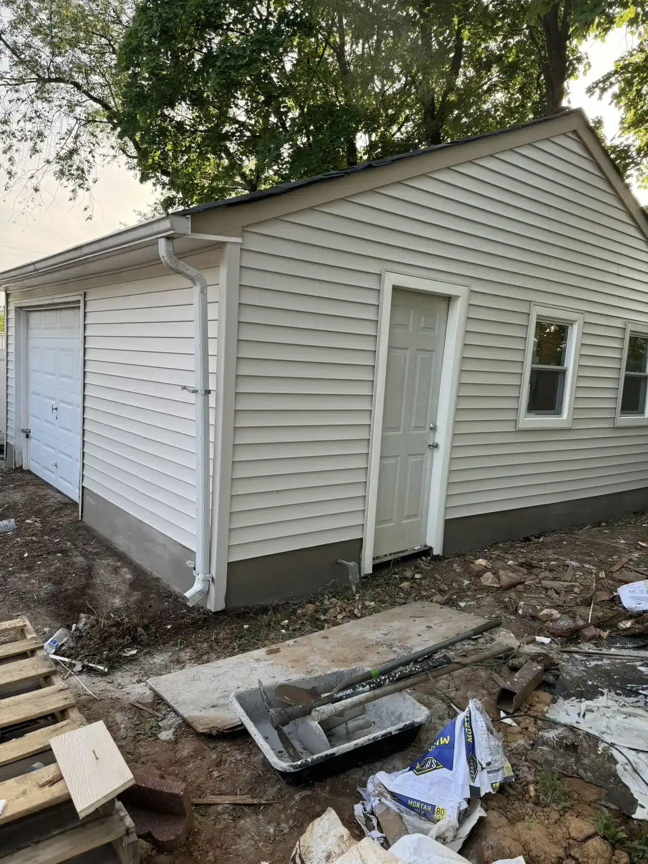 Completed detached garage with new vinyl siding