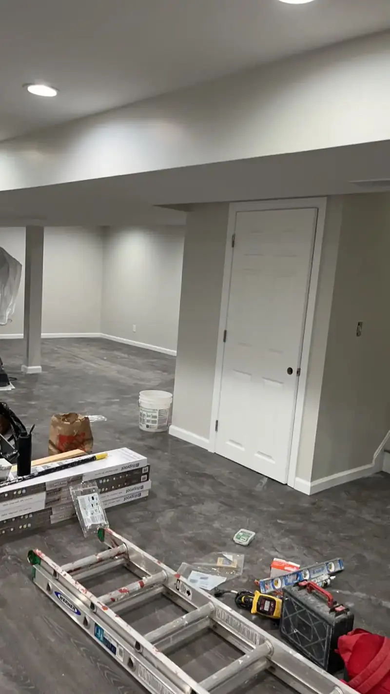 Finished basement with recessed lighting and luxury vinyl plank flooring