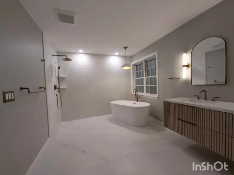 Finished bathroom walkthrough: fluted wood vanity and freestanding tub