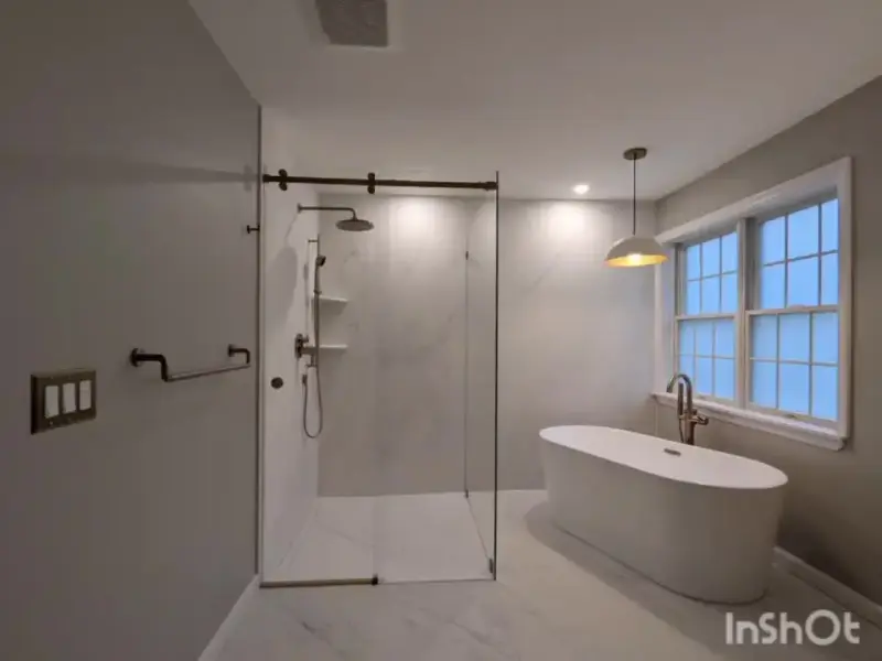 Finished bathroom walkthrough: freestanding tub and glass shower