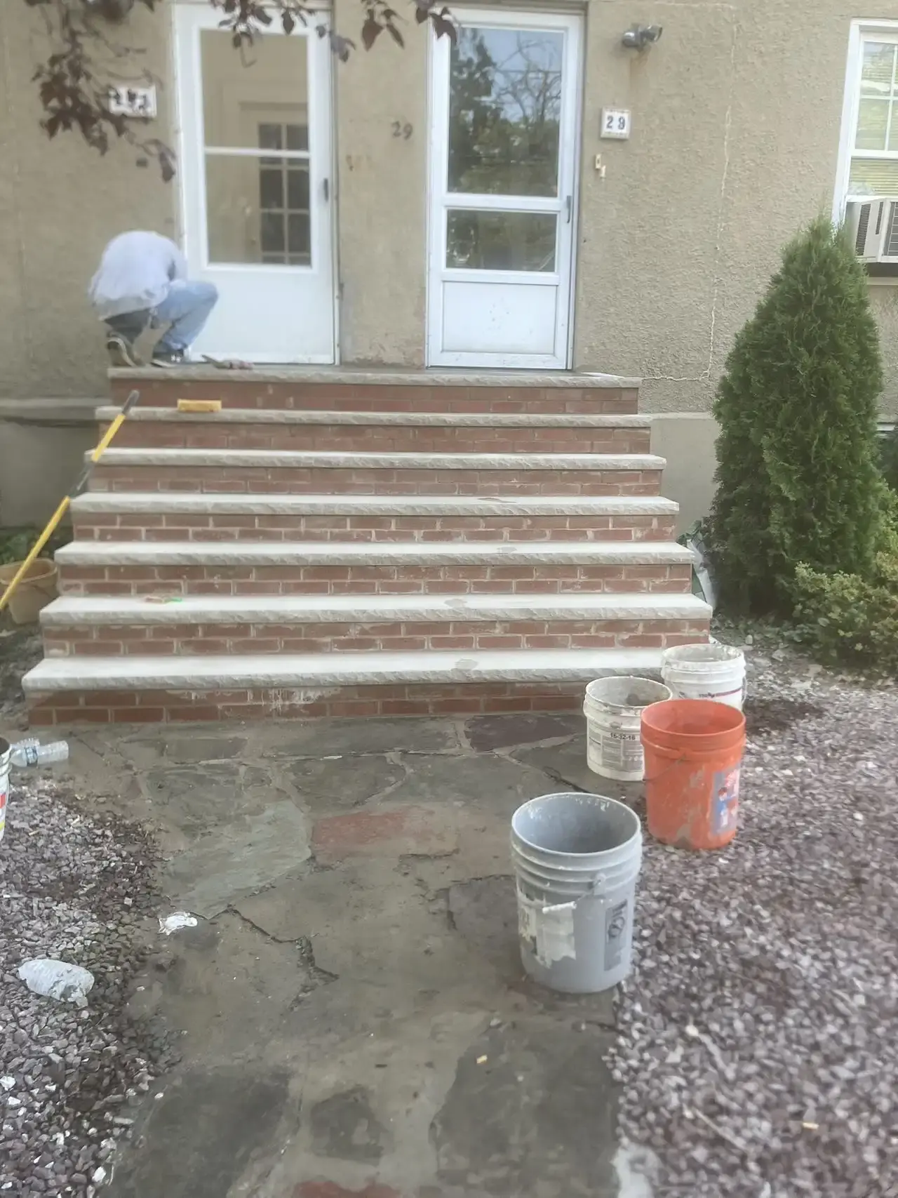 Rebuilding brick front steps with a stone landing