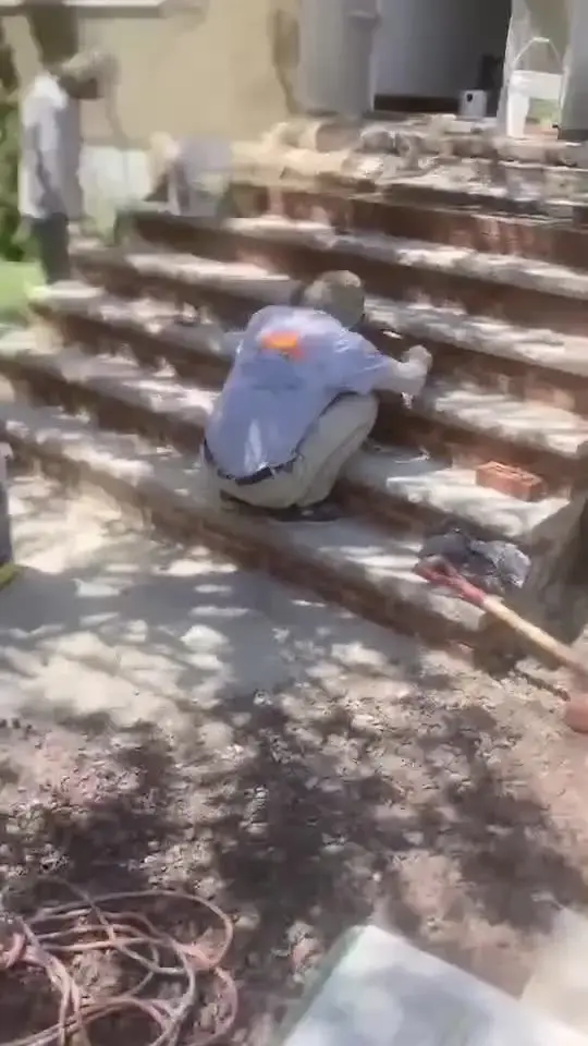 Masonry crew rebuilding front steps