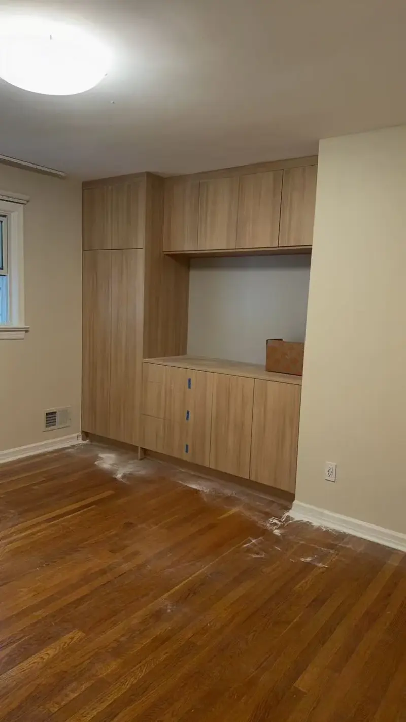 Built-in wood wall cabinets with an open niche in a finished room