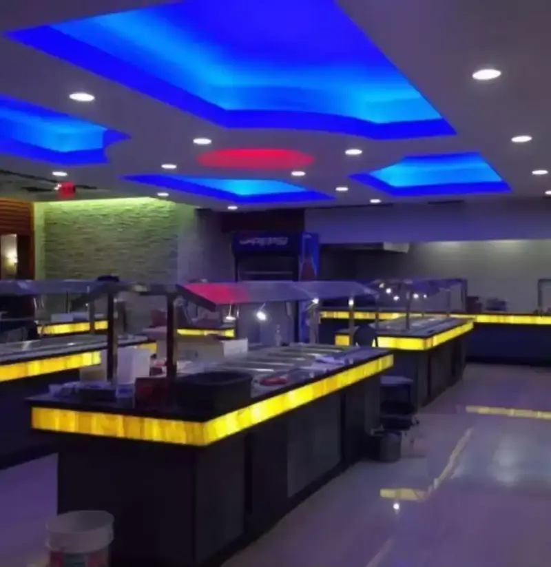 Buffet dining room with LED tray ceiling and lit serving counters